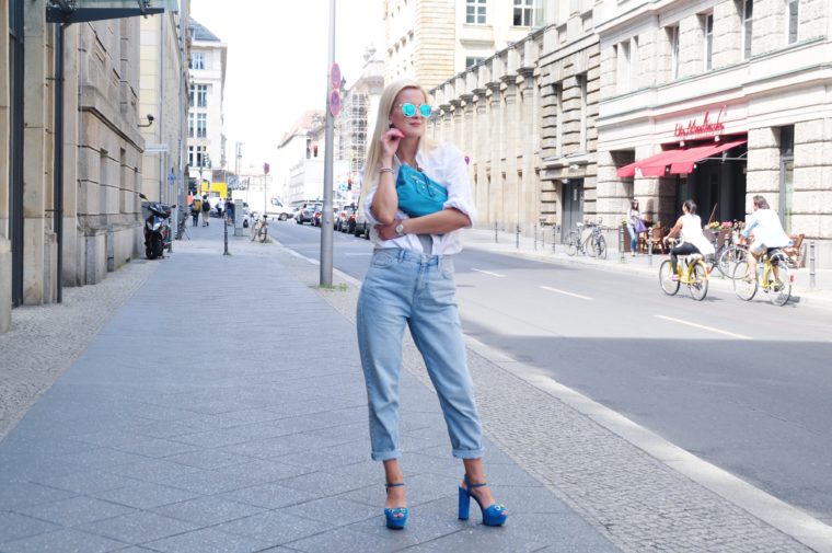 white oversized shirt with mom vintage jeans