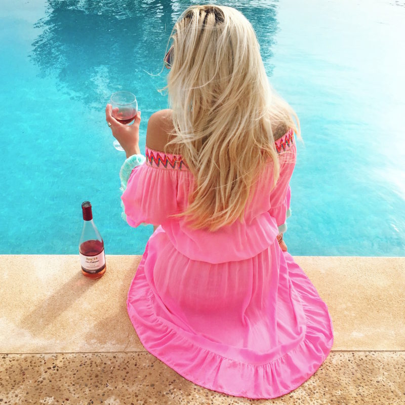 pink off shoulder beach dress, pool, wine