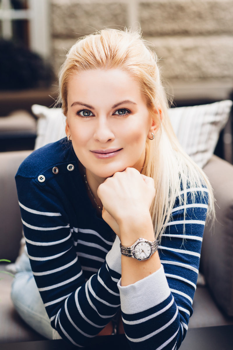 sporty style, blue white striped shirt, blonde, silver watch